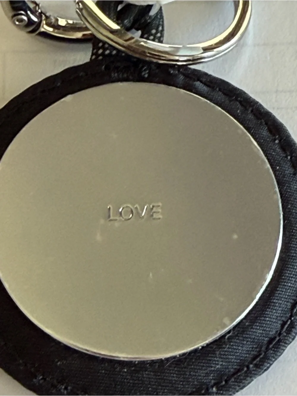 Lululemon Round Logo Keychain in Black and Silver